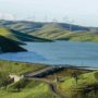 Los Vaqueros Resevoir with rolling hills and wind farm in background